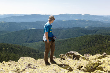 Young man traveling on a mountain top