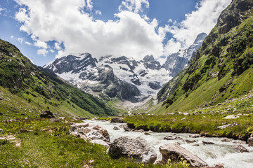 Alpine meadows and rocks in the Caucasus mountains in Russia. Peak Dalar.