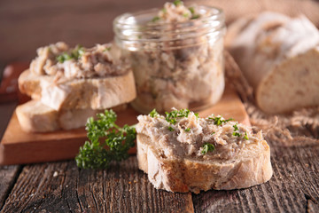 bread toast with meat spread on board