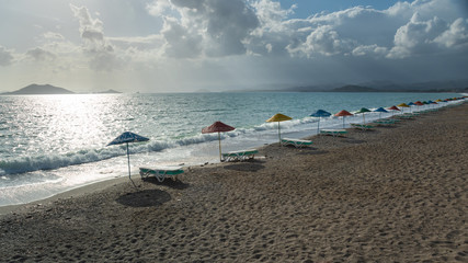 Fototapeta na wymiar Beach with colored umbrellas