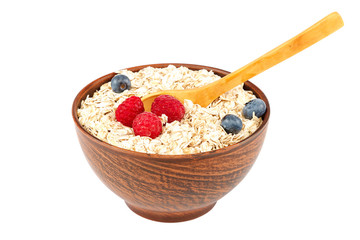Fresh blueberries, raspberries, waffle cookies and oatmeal