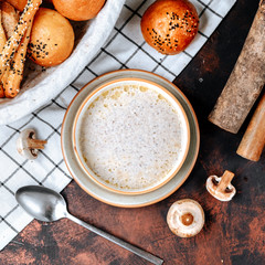 creamy mushroom soup with cream on the table