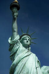 Fototapeta na wymiar Ellis Island during clear day with Statue of Liberty