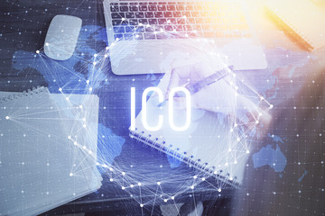 Cryptocurrency hologram over hands taking notes background. Concept of blockchain. Multi exposure