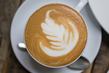 top view cappuccino coffee on wood table background