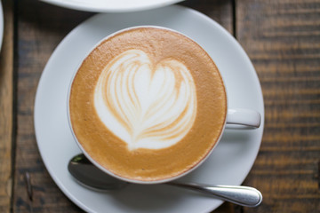 top view cappuccino coffee on wood table background