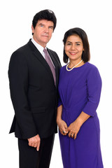 Studio shot of happy mature couple isolated against white background