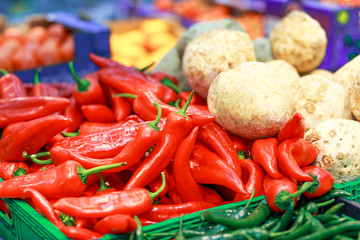 red pepper and radish in boxes on the counter