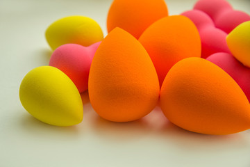 bright beauty blenders on a white background