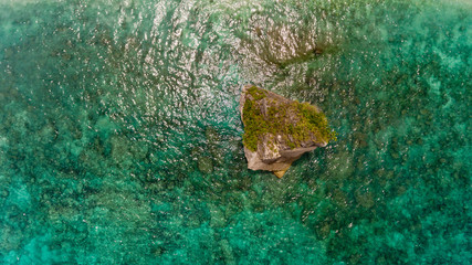 Top view of a cliff in the sea from above