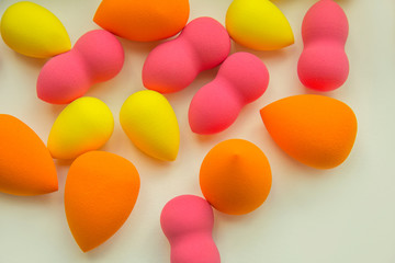 bright beauty blenders on a white background