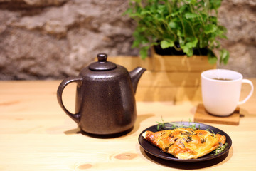 tea cup and salty patty. salty butter scone for a snack