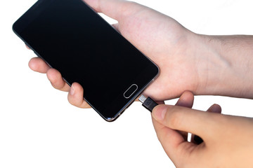 Man charging black phone isolated