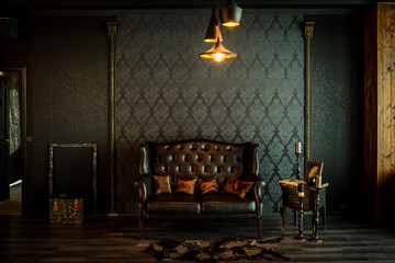 Old vintage interior with leather sofa - obrazy, fototapety, plakaty