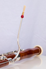 Wooden bassoon isolated on a white background. Music instruments.