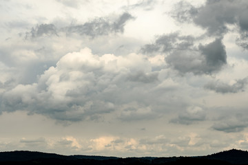 Obraz na płótnie Canvas Heavy rain clouds over land