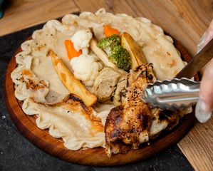 fried chicken with vegetables in lavash