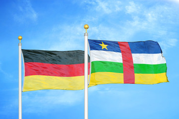 Germany and Central African Republic two flags on flagpoles and blue cloudy sky