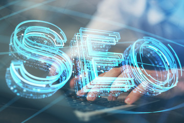 Multi exposure of seo icon with man working on computer on background. Concept of search engine...