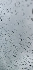 Rain drops on a windshield with copy space for text.
