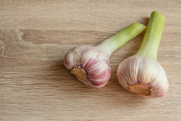 young garlic on a wooden background