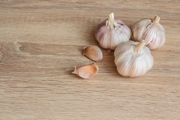 winter garlic on a wooden background
