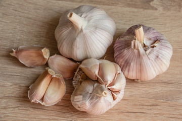 winter garlic close-up on a wooden background