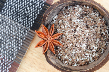 Homemade face and body scrub (foot soak) with sugar, ground cofee, coconut oil and shredded coconut. Diy natural beauty treatment and spa recipe. Top view, copy space