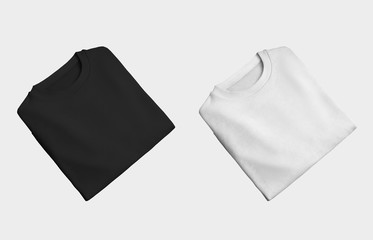 Set of branded folded male clothes isolated on background, white and black blank sweatshirt for...