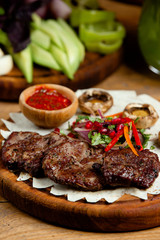 fried meat with vegetables and mushrooms