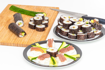 Tuna Sushi Japanese food makis and rolls on bamboo board