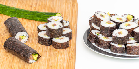 Tuna Sushi Japanese food tuna makis and rolls on bamboo board