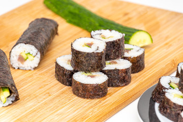 Tuna Sushi Japanese food tuna makis stacked on bamboo board