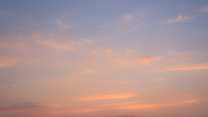 Naklejka na ściany i meble pink pastel clouds blurred at sunset blue sky. abstract photo, background image.