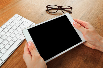 female hands holding smart phone on wooden background  , place for your text  .