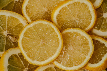 juicy slices of lemon sprinkled with sugar close-up