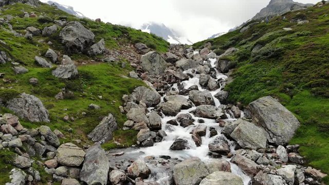 Switzerland Waterfall - drone shot - in the mountains