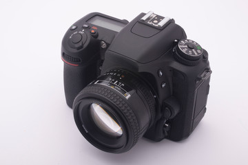 Fototapeta premium black SLR camera on a white background