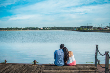 Fototapeta premium wedding couple hugging looking at the sea