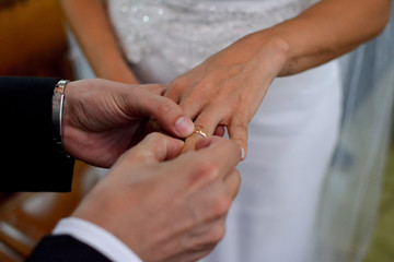 Obraz na płótnie Canvas bride and groom with their rings