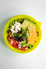 fruit vegetable salad with cheese on the table