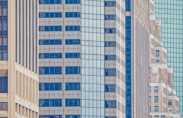 Architectural detail of Manhattan building facade during the gloomy weather visible from the Staten Island Ferry in New York.