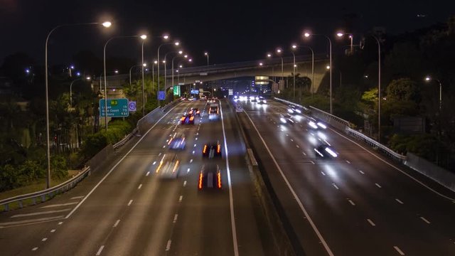 Time lapse: night view of vehicles on six-lane highway and lights, Brisbane, Australia