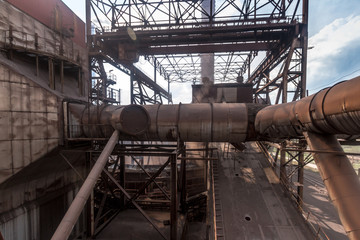 General view of the sinter plant. Submission of iron ore for sintering before entering the blast furnace. Metallurgical production. Day panorama