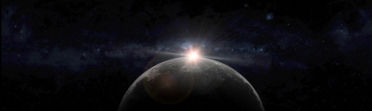 Setting sun behind moon