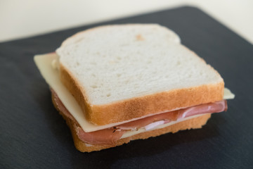 Toast, slices of white bread stuffed with speck and cheese.