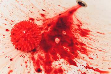 Splashes of blood dripping into the sink in the bathroom. red virus molecules