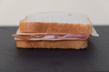 Toast, slices of white bread stuffed with speck and cheese.