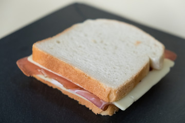 Toast, slices of white bread stuffed with speck and cheese.