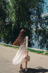 girl in a white dress on the street
